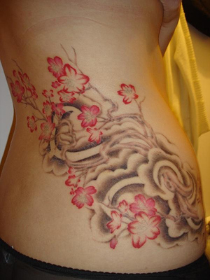 pictures of flower tattoos. flower tattoos on hip.