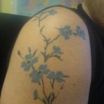 Orange Flower Tattoo on Shoulder