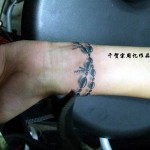 Ornamental bracelets tattoo on hand